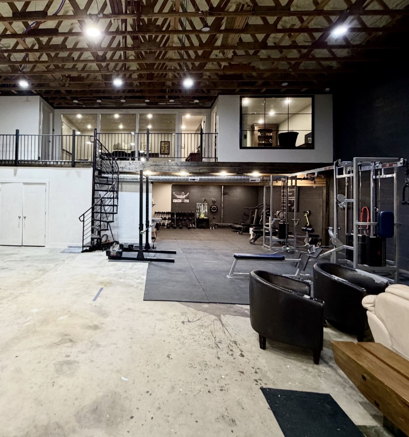 The BCB space: a private gym on the main floor with offices and a conference room on the mezzanine above.